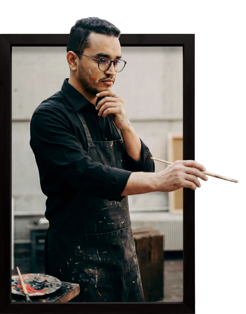 this is me standing in a black suit in my studio